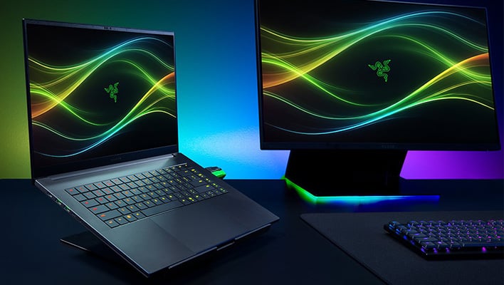 Render of Razer's Blade 16 laptop next to a monitor.