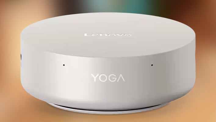 Front render of Lenovo's Yoga Mini i Gen 11 mini PC on a blurry background.