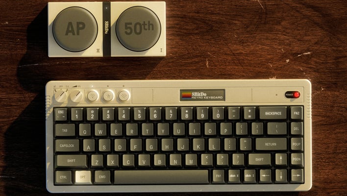 Top-down view of 8BitDo's Retro 68 - AP50th Limited Edition keyboard on a desk.