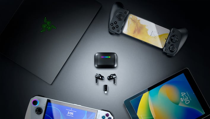 Razer Hammerhead V3 HyperSpeed earbuds, charging case, and wireless dongle next to a Razer laptop, gaming handheld, smarthone with controllers attached, and a tablet.