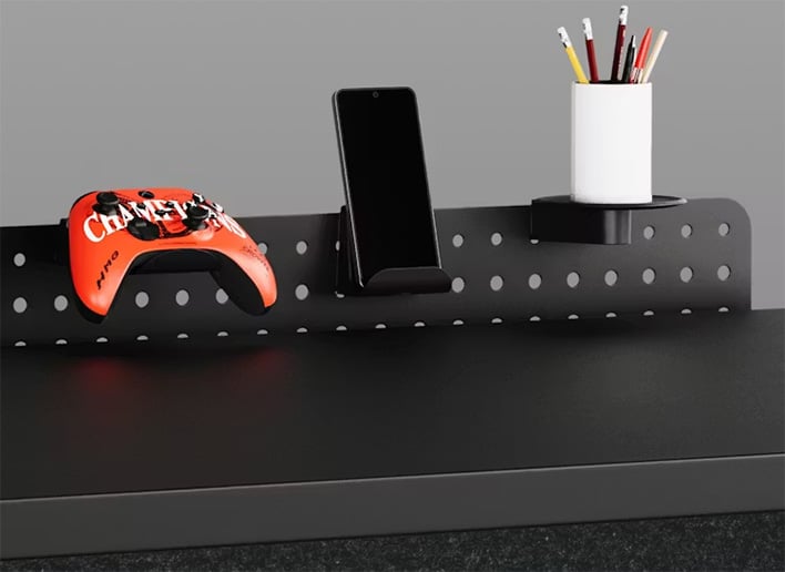 Closeup of the perforated backplate on Herman Miller's Coyl desk.