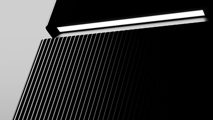 Closeup angled view of TP-Link's Archer 8 Wi-Fi 8 router on a gray background.