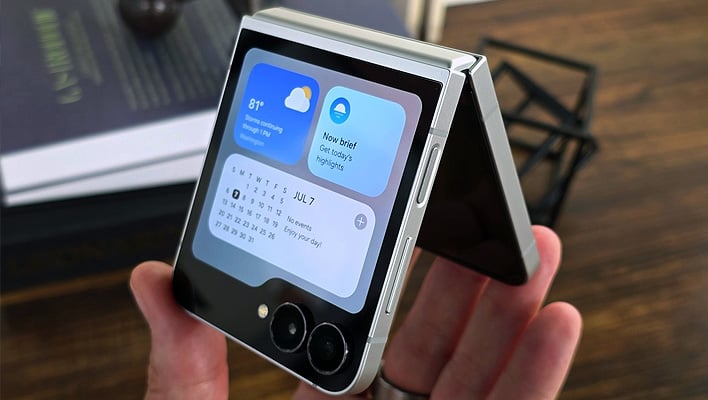 Samsung Galaxy Z Flip7 FE partially folded in a hand.