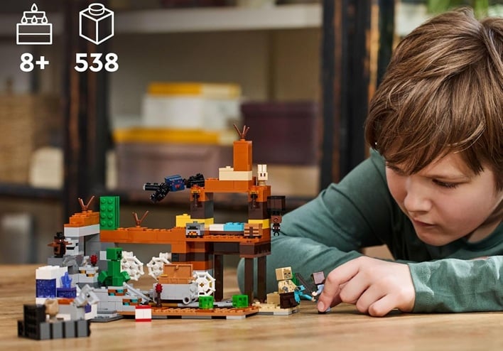 boy playing with minecraft lego
