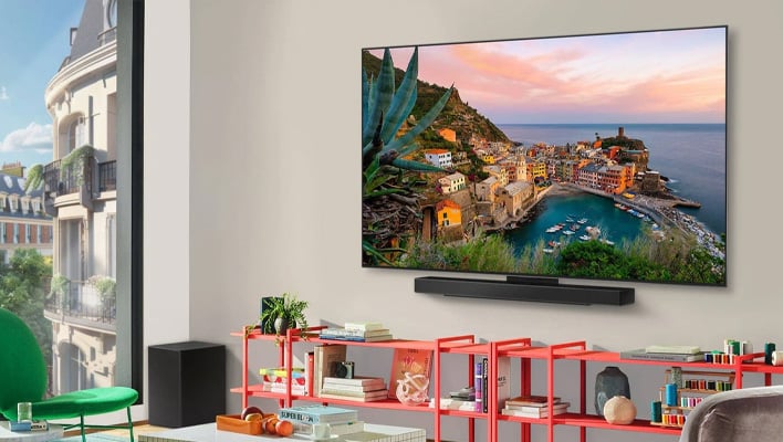 Angled render of LG's OLED TV on a wall in a living room.