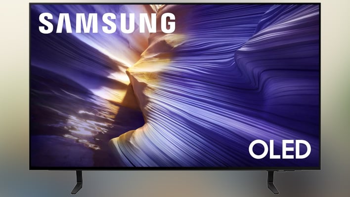 Samsung S90F TV on a blurry background.