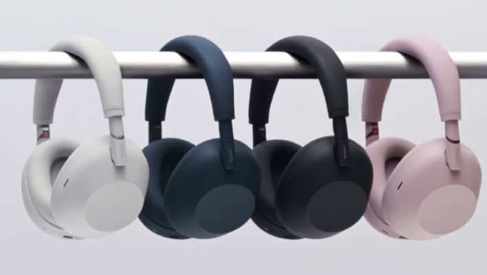 Sony WH-1000XM6 headphones in different colors, hanging from a bar.