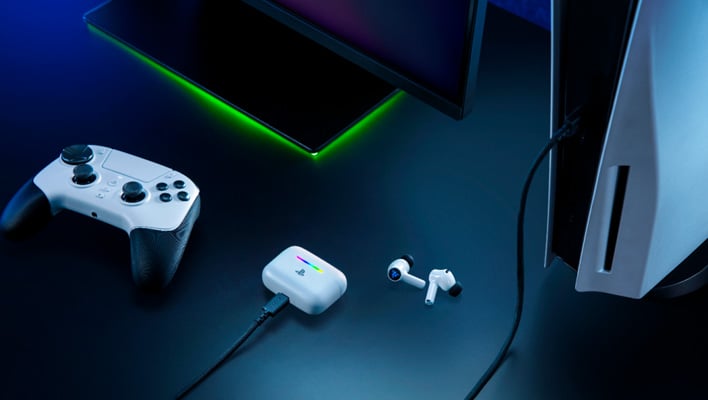 Razer Hammerhead V3 X HyperSpeed for PlayStation. The charging case is connected to a PS5. There is a game controller nearby.