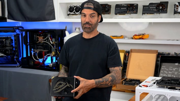 Kingpin holding an ASUS ROG PSU.